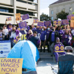 SEIU 2015 members in Sacramento County holding signs that say livable wages now!