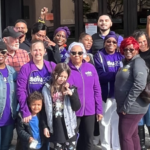 Sacramento IHSS workers and allies stand in front of the County Administration Building