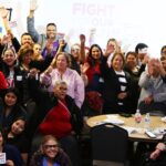 SEIU 2015 members in front of signs that read Fight for Our Health